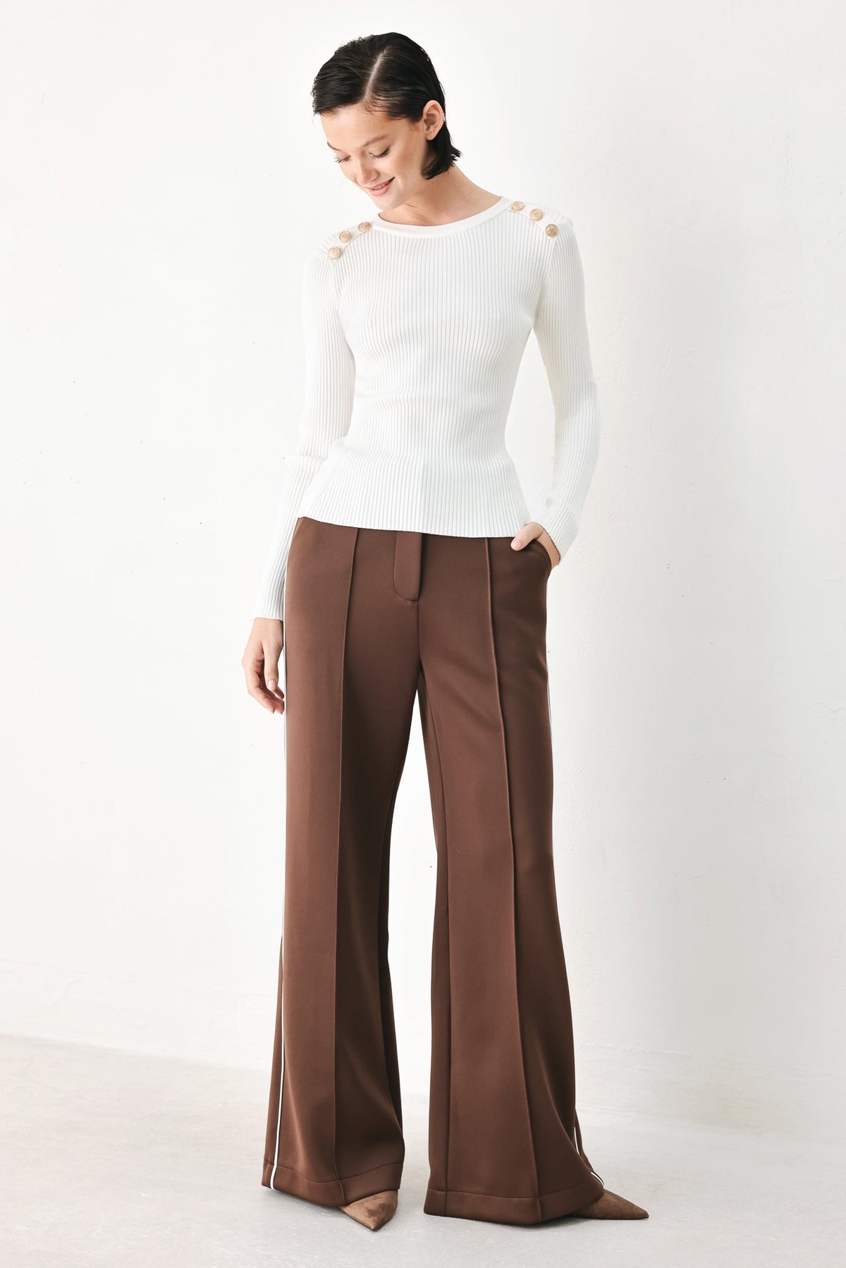 Off-white ribbed knit sweater top with long sleeves and crew neck