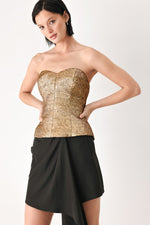 Gold metallic sweetheart tube top with structured corset seams and peplum hem