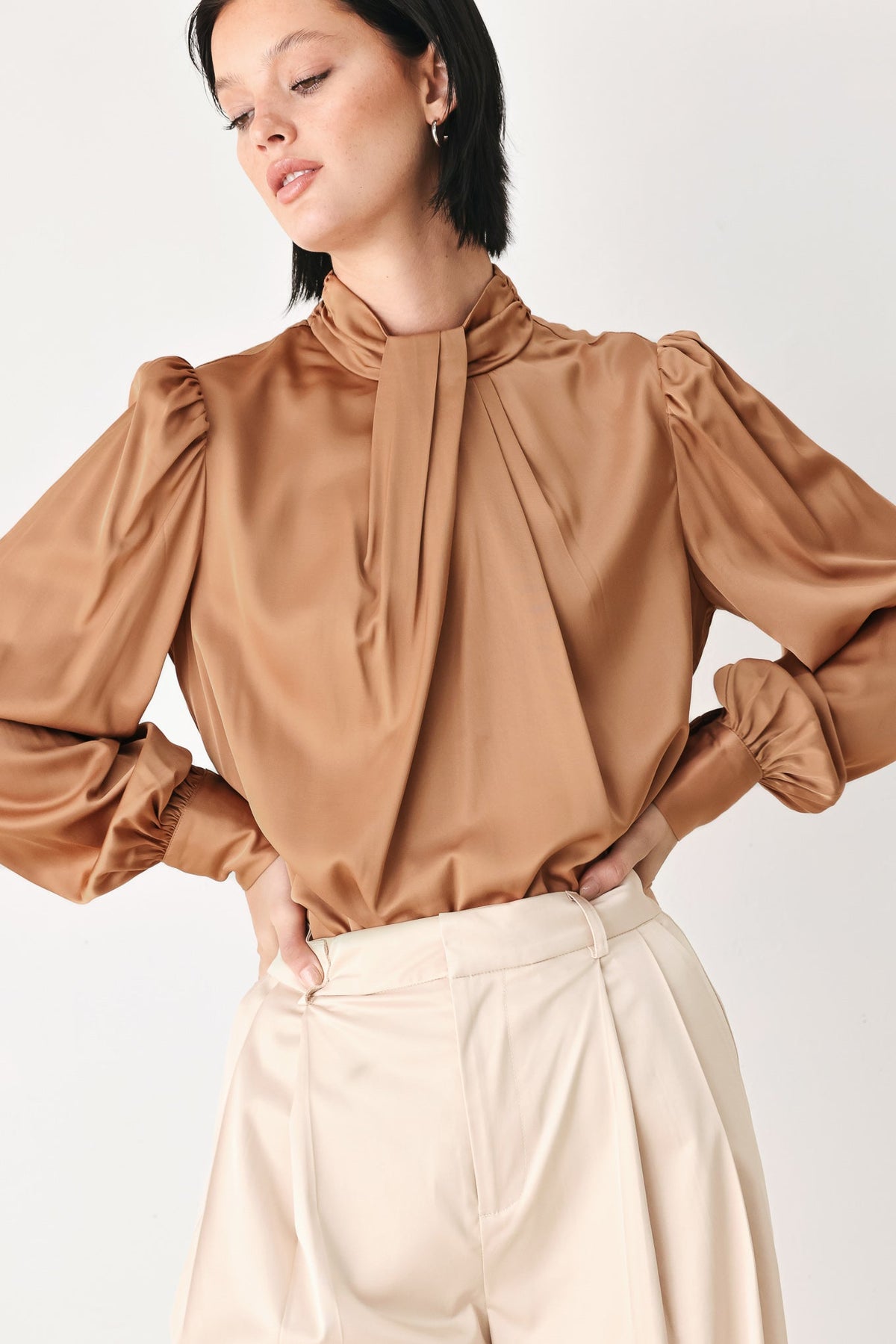 Bronze high-neck blouse with tie neckline and puff sleeves, gathered shoulders