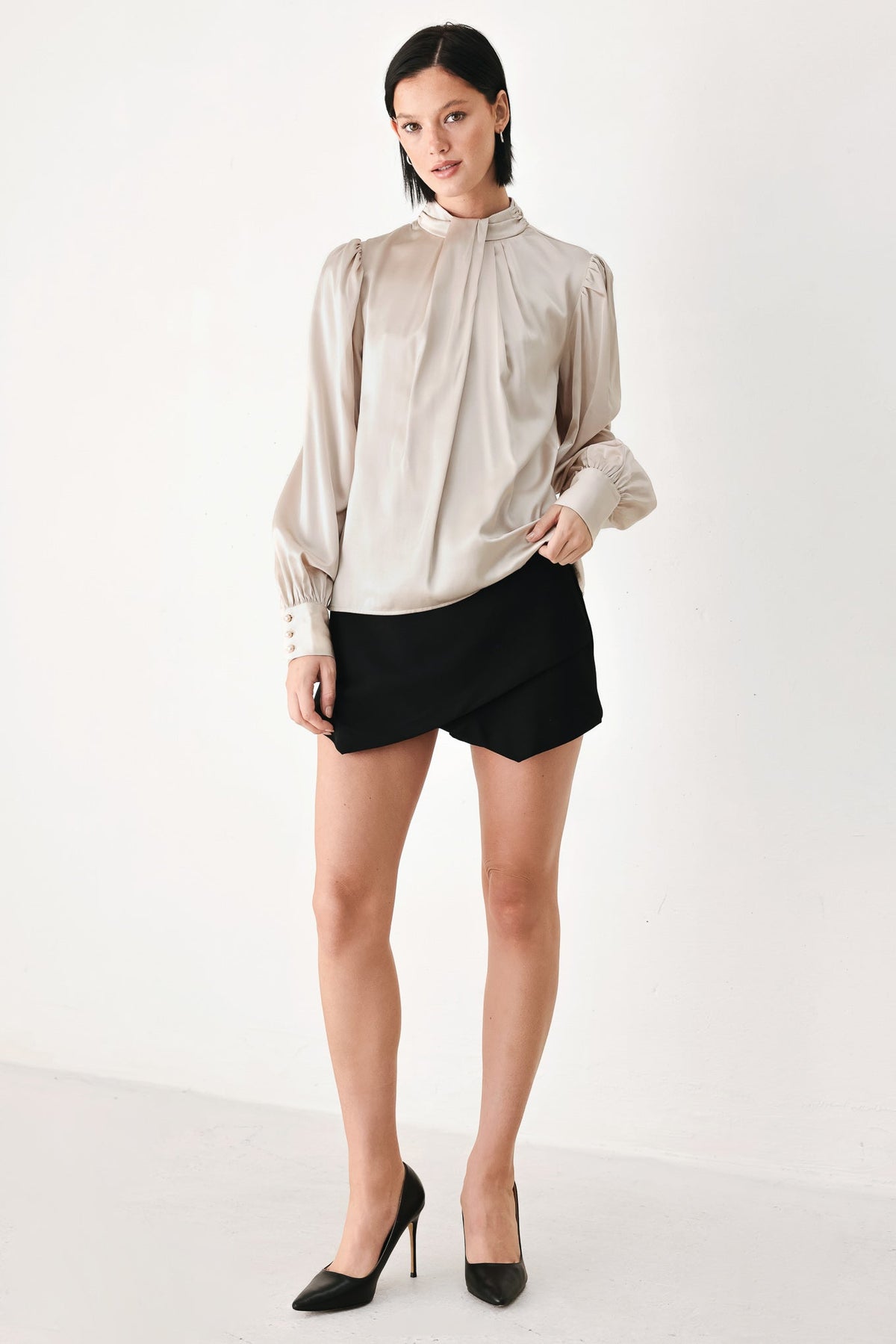 Champagne satin high-neck blouse with long puff sleeves and gathered cuffs