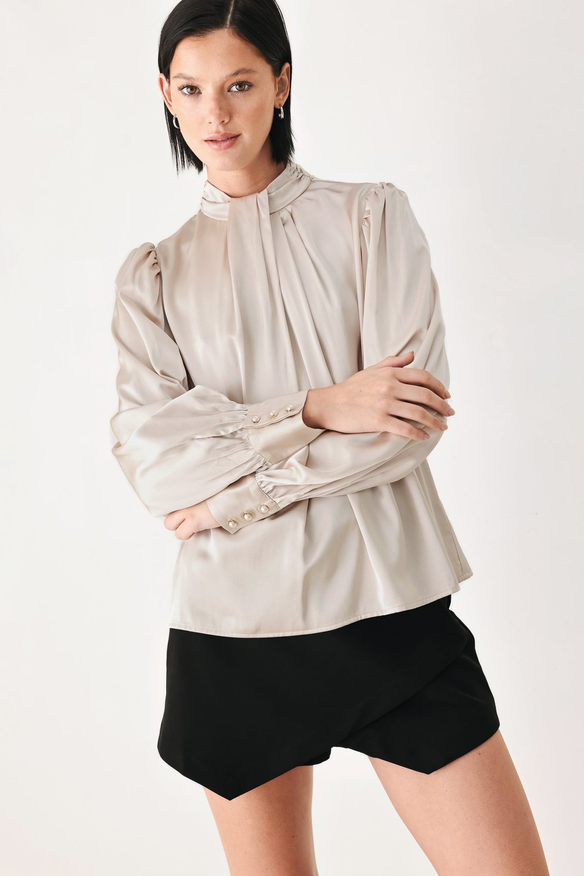 Champagne high-neck blouse with tie collar and buttoned puff sleeves