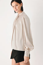Champagne high-neck blouse with pleated front, long balloon sleeves, elastic cuffs