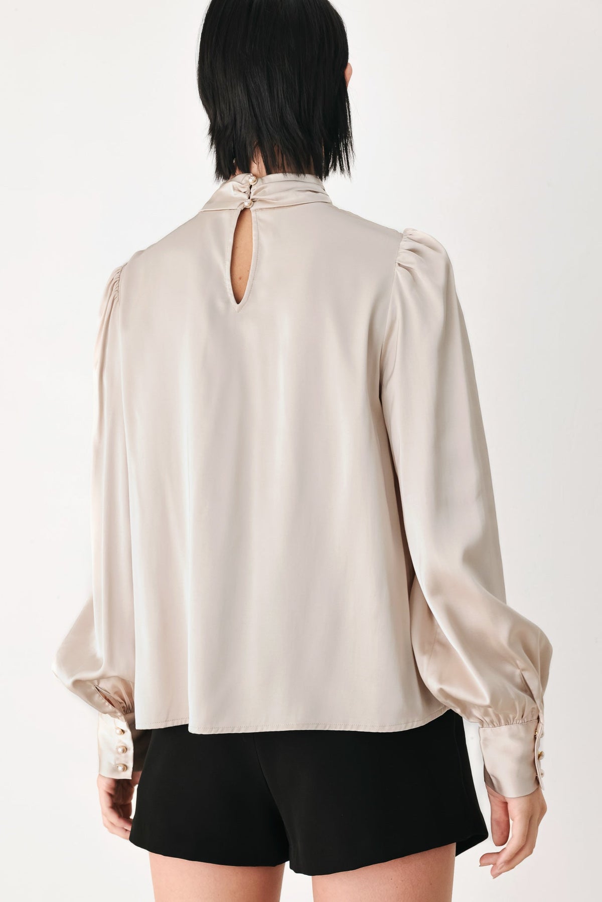 Champagne high-neck blouse with keyhole back opening and long puff sleeves