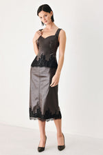 Dark brown faux leather sheath top with black lace panel along the hem