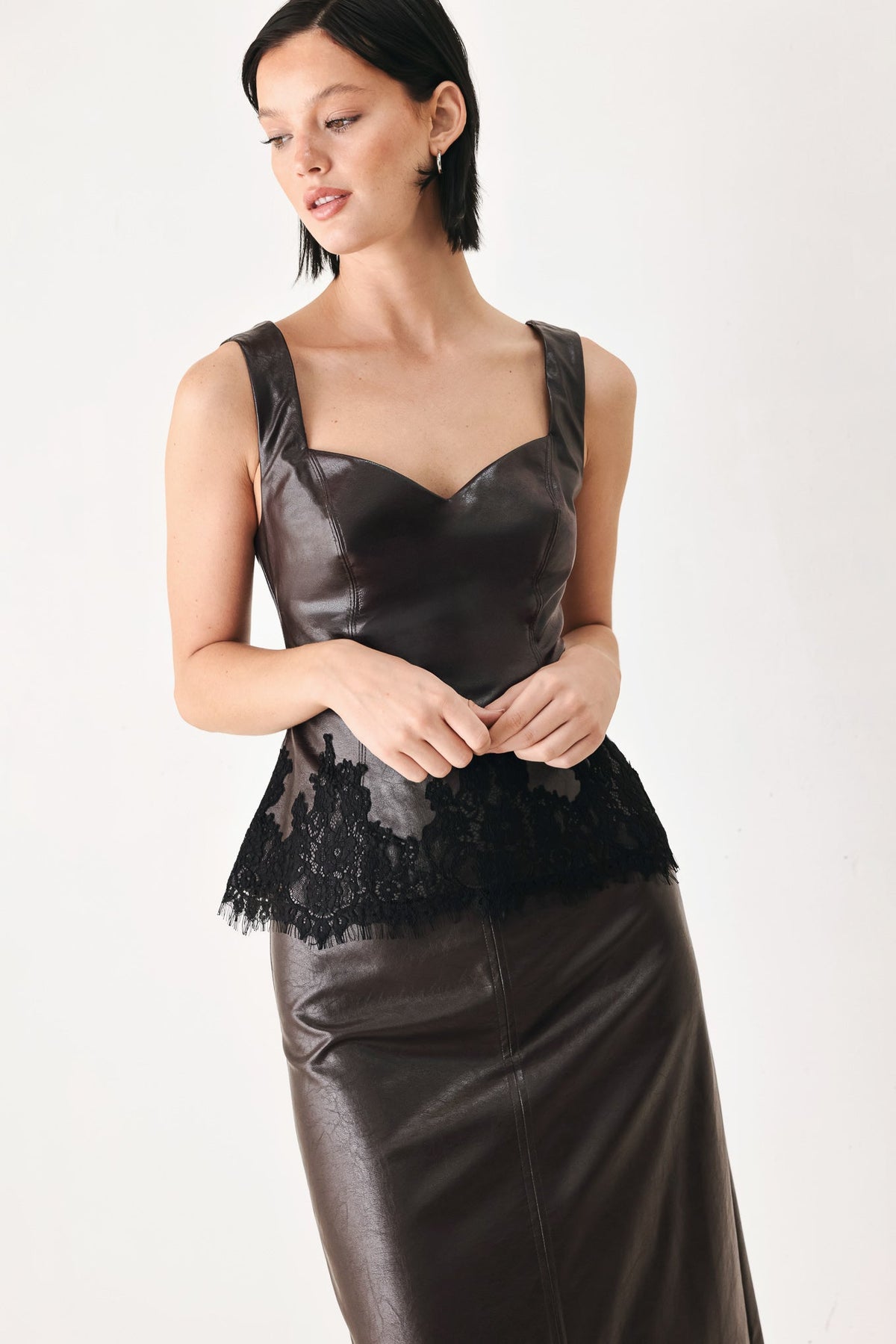 Dark brown faux leather sweetheart camisole top with black lace scalloped hem