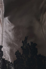 Dark brown faux leather top with black lace trim