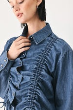 Indigo denim button-down top with ruched texture and front button placket detail
