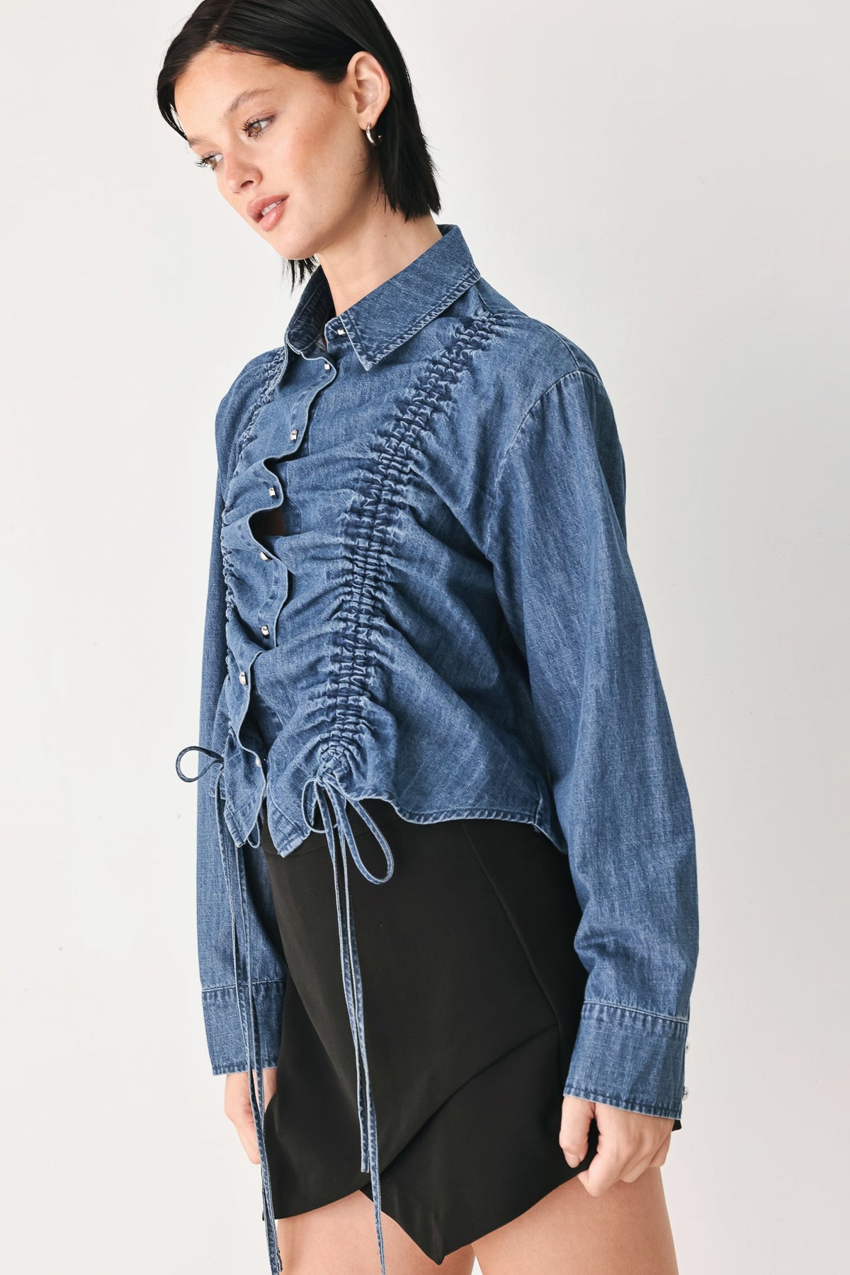 Indigo denim button-down top with side drawstring ties and ruched front panel