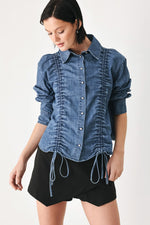 Indigo denim button-down top with gathered ruched front and hanging drawstring ties