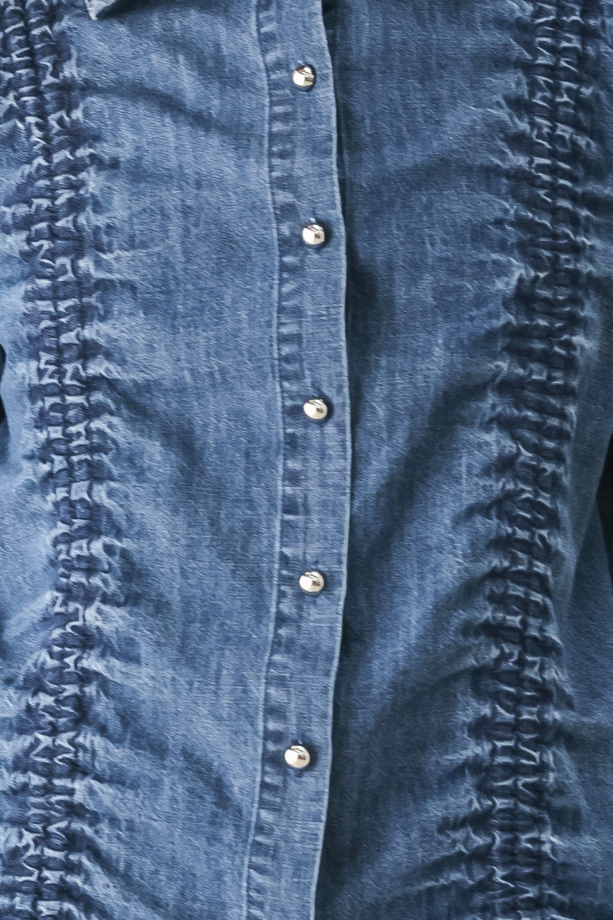 Indigo denim button placket with metal buttons and ruched textured side trim