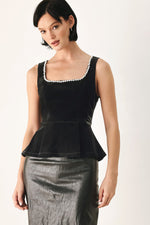 Black sleeveless velvet peplum top with square jeweled trim at neckline