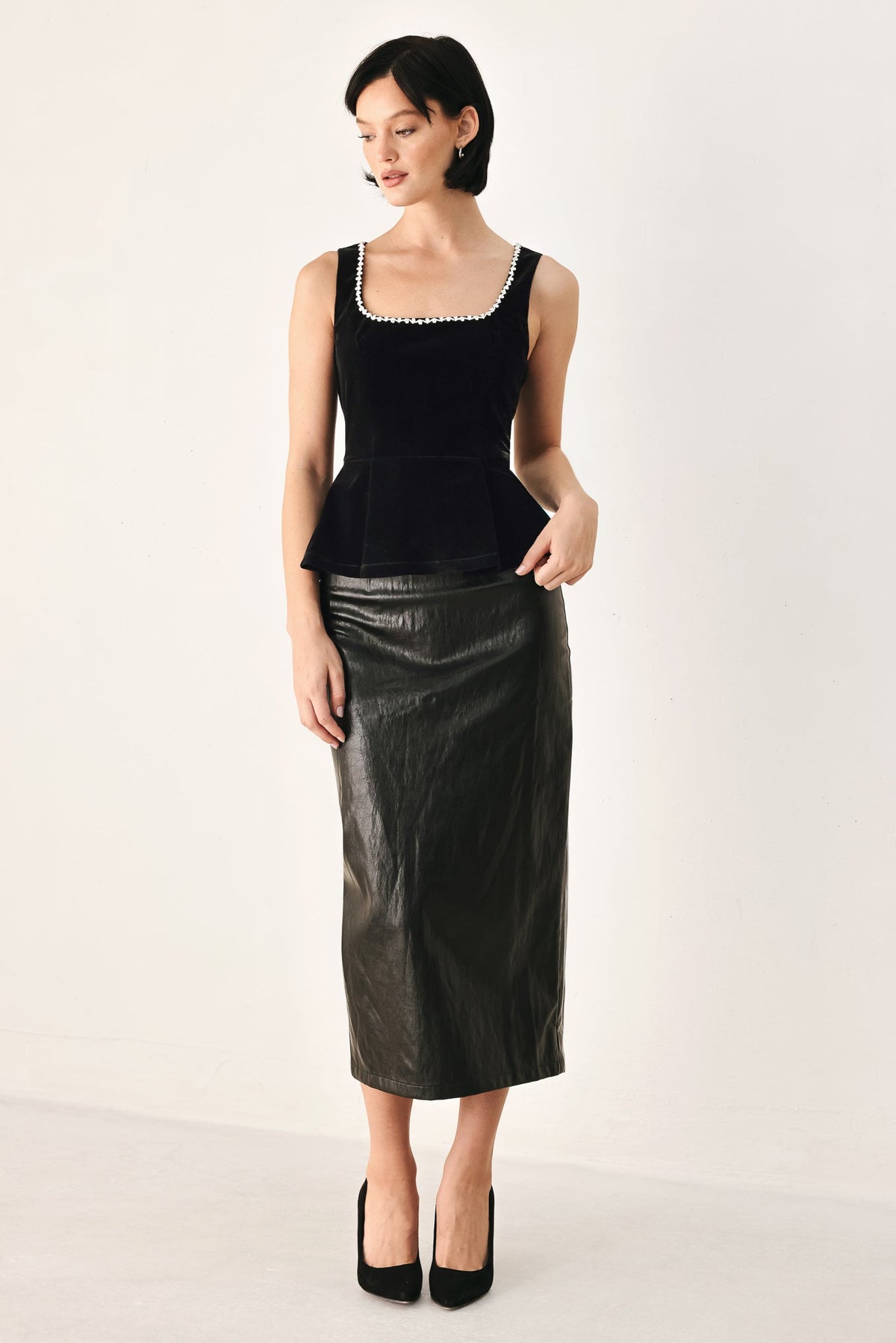 Black velvet peplum top with jeweled square neckline, sleeveless