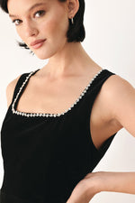 Black sleeveless velvet top with square neckline and jeweled embellishment trim