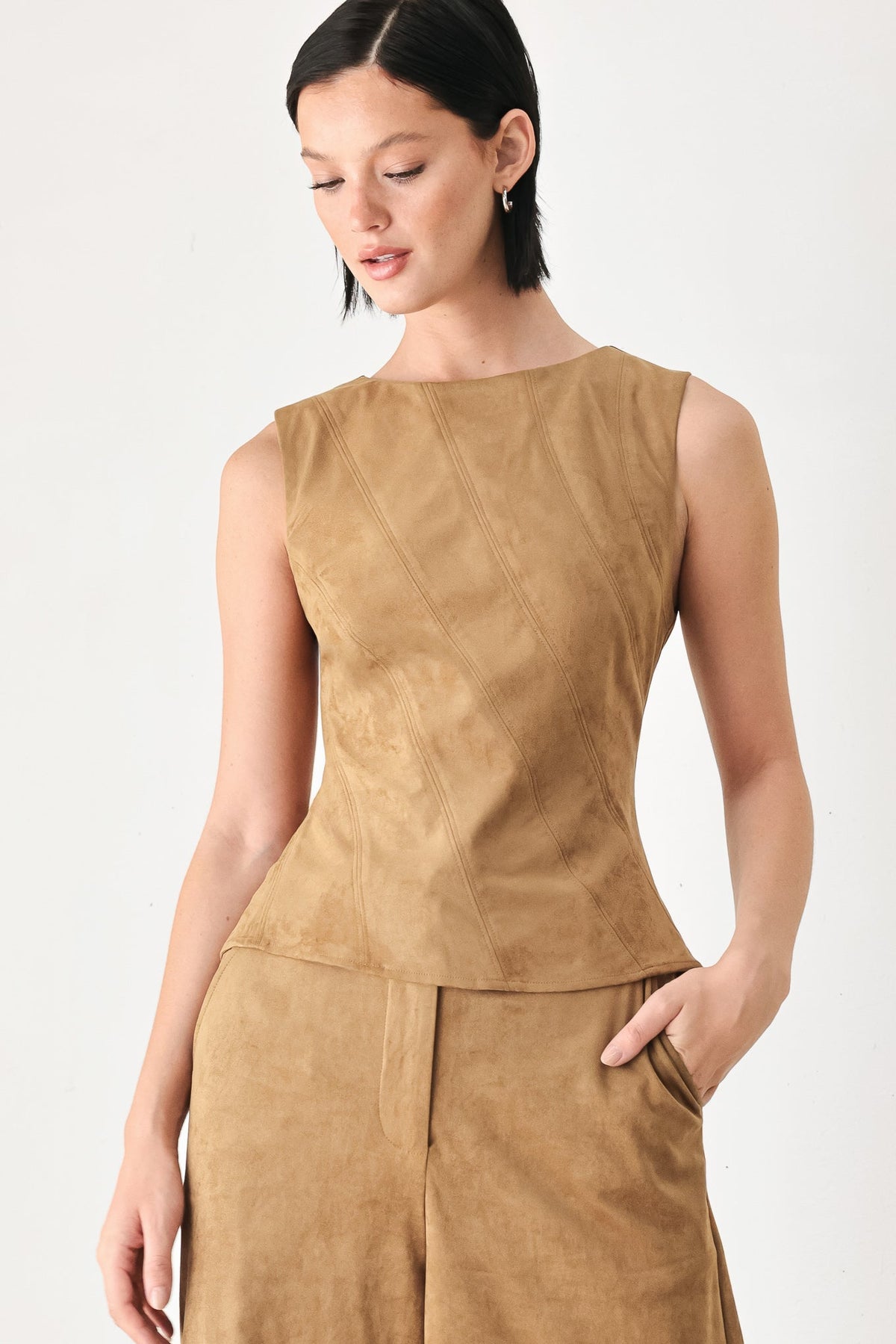 Camel faux suede sleeveless top with peplum hem and diagonal panel stitching