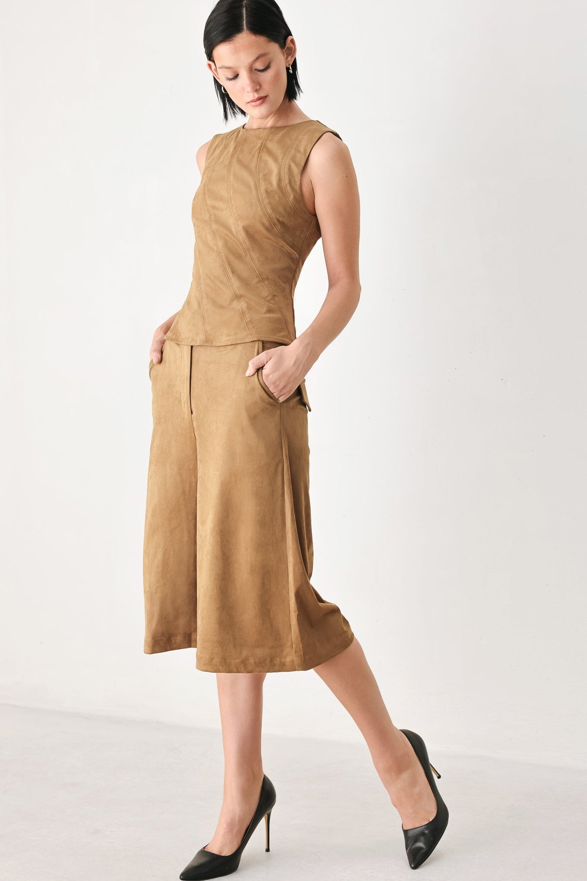 Camel sleeveless faux suede top with peplum detail and matching midi shorts