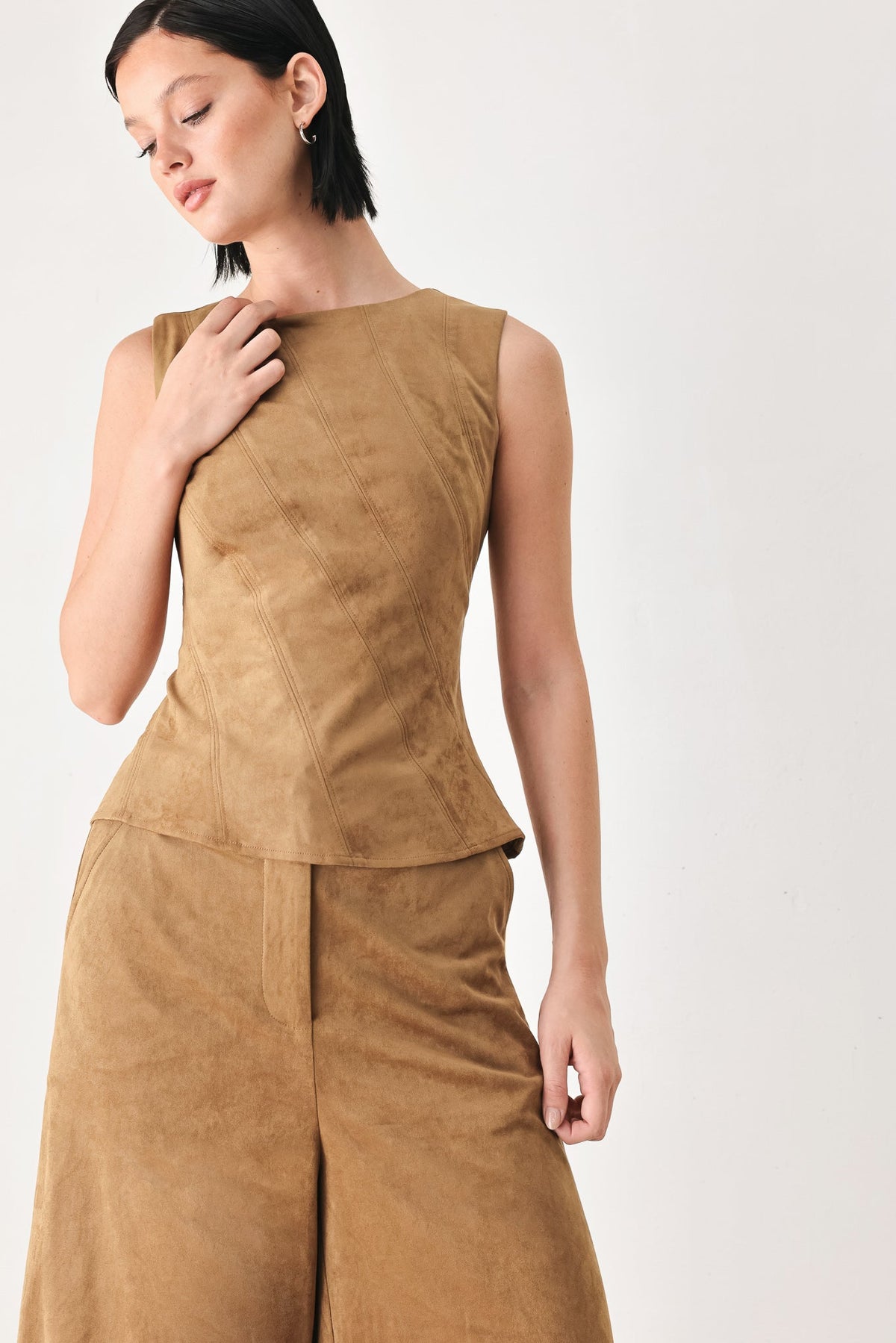 Camel faux suede sleeveless top with high round neckline and peplum waist