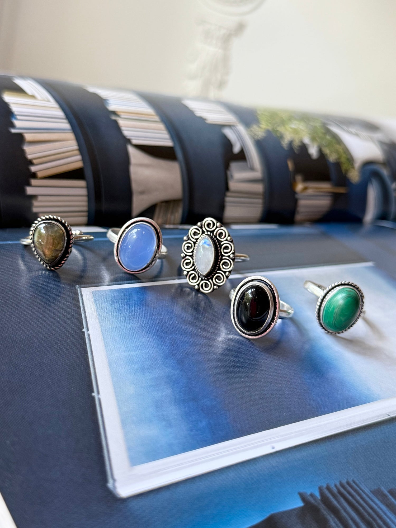 Gemstone ring set: blue, green, and black oval stones in silver-tone settings