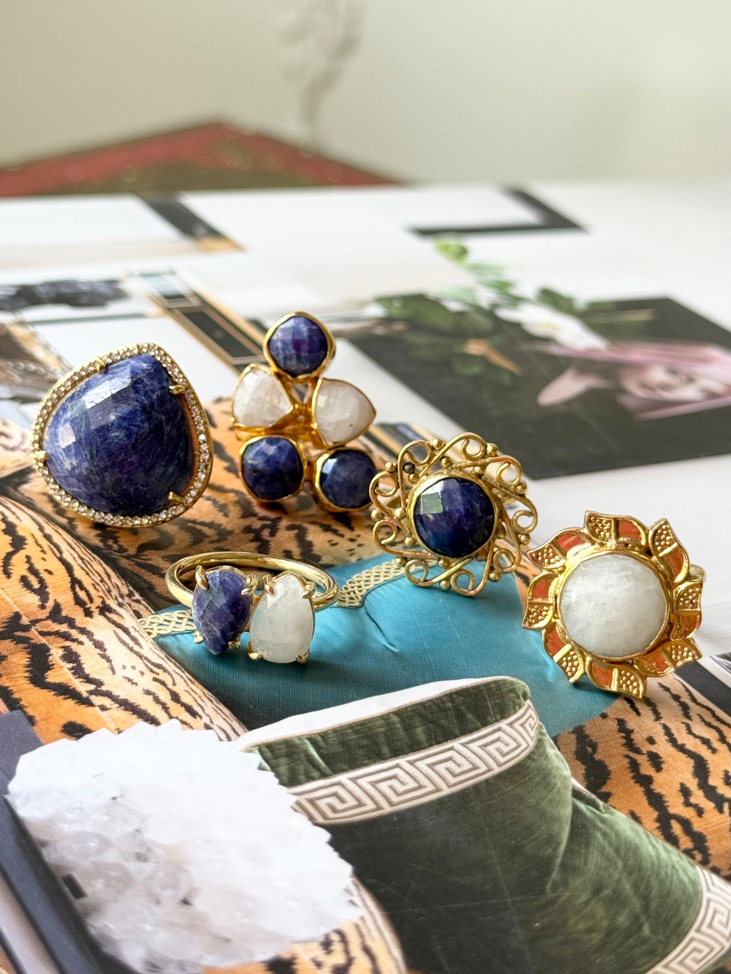 Gold-tone jewelry set with blue lapis and white stones, includes ring and earrings