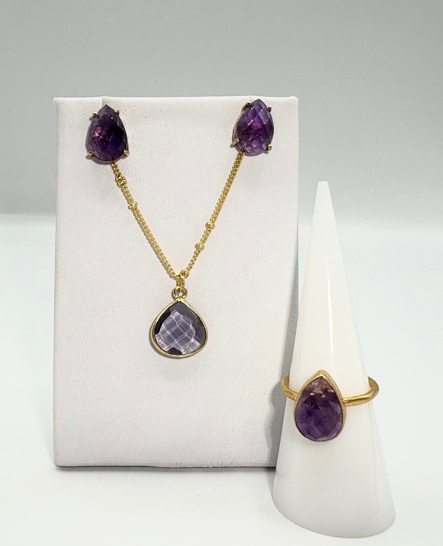 Amethyst quartz necklace and stud earrings set with gold-tone chain and purple stones