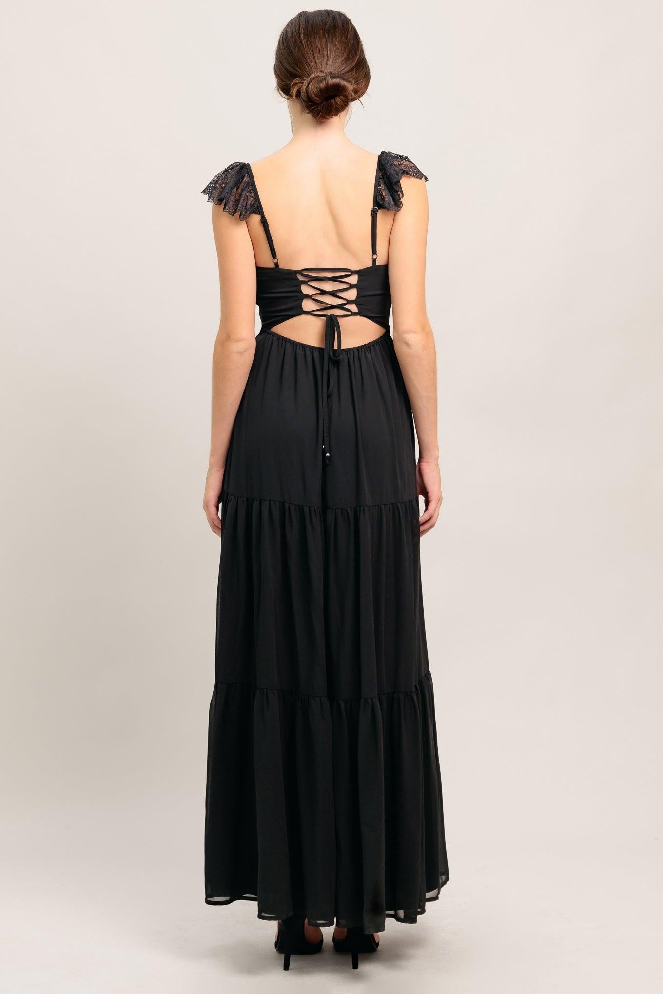 Black maxi dress back with crisscross lace-up straps and layered tiered skirt.