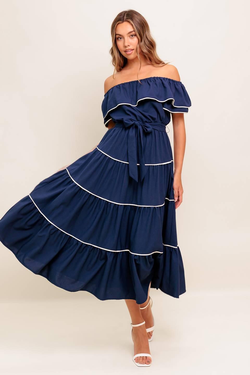 Navy off-shoulder tiered midi dress with white trim and bow-tied waist.