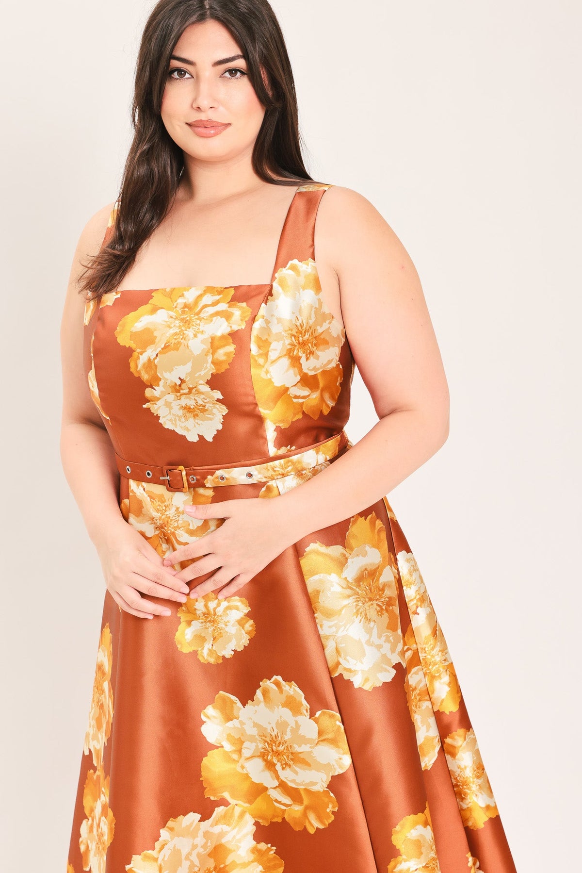 Rust sleeveless maxi dress with cream and orange floral print, wide belt, square neckline