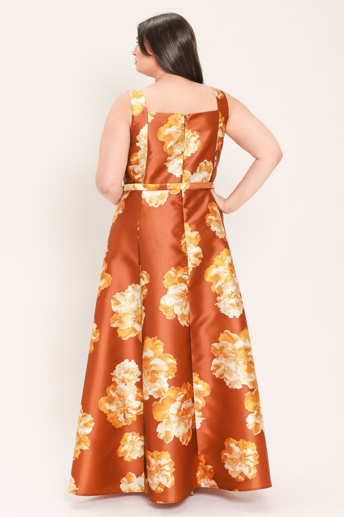 Rust floral maxi dress back view with square straps, cinched waist belt, flowy skirt