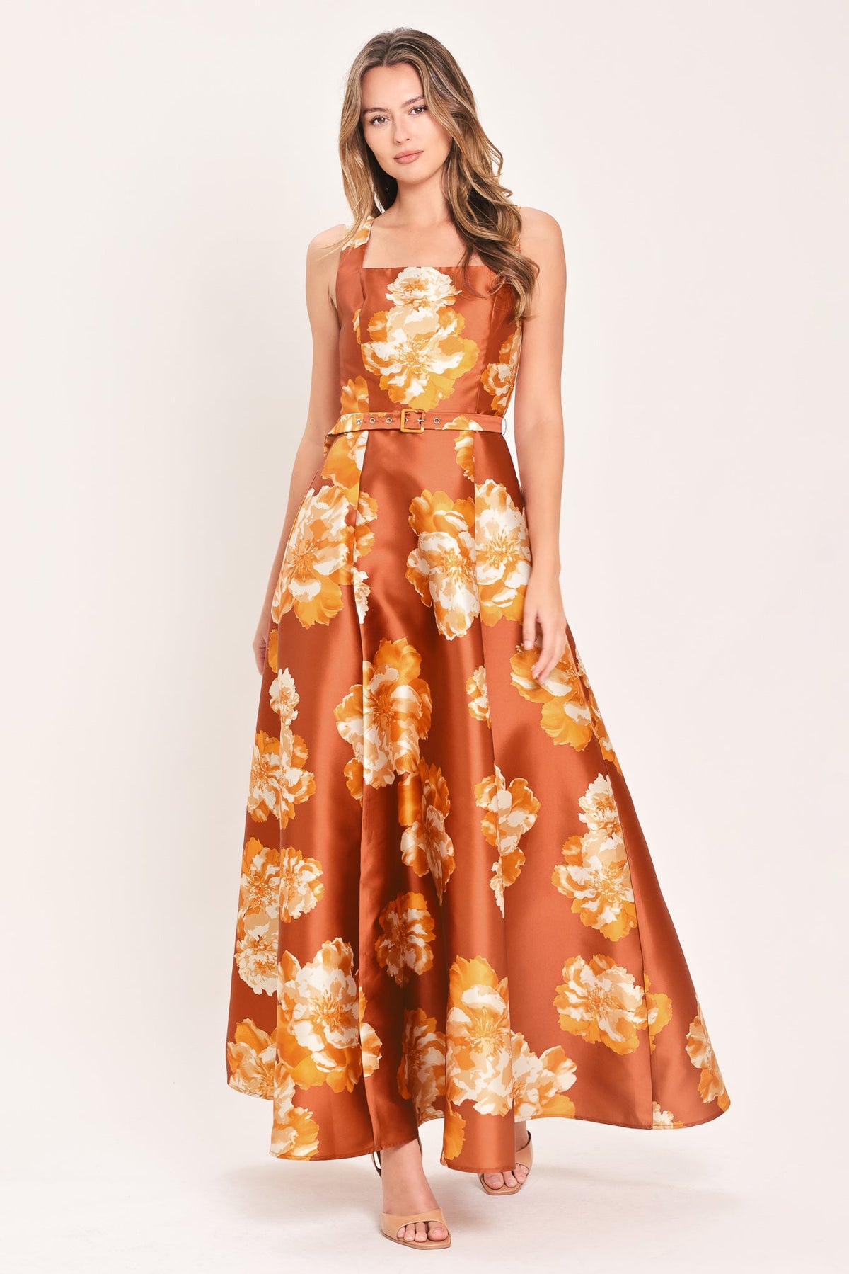 Rust maxi dress with orange floral print, square neckline, sleeveless bodice, waist belt