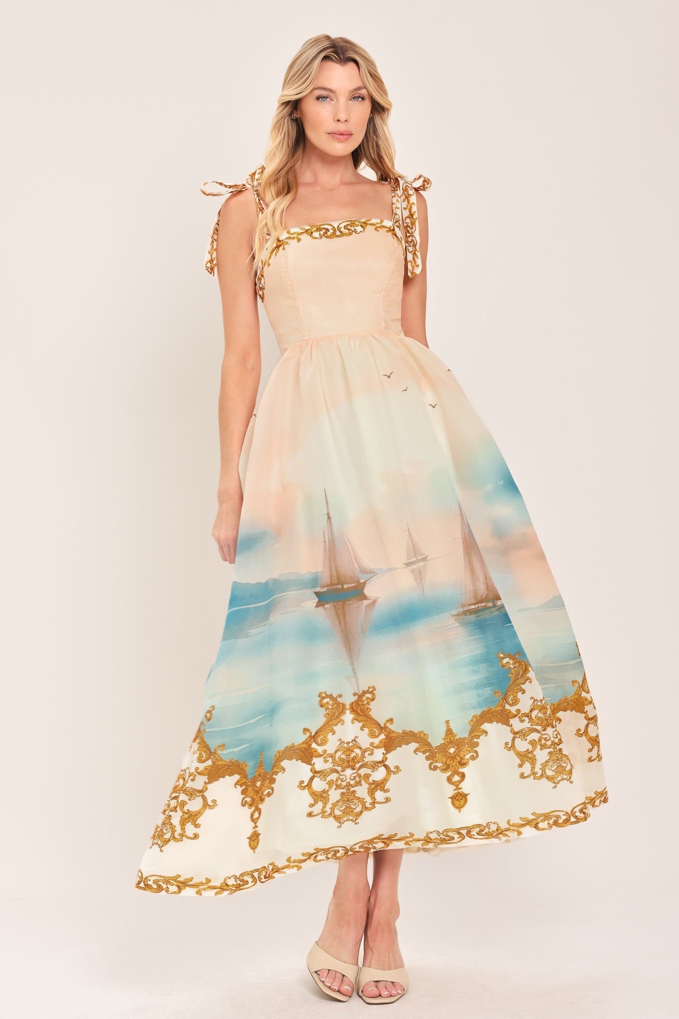 Woven midi dress with square neckline, gold tie-shoulder trim, coral-to-blue harbor print