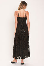 Back view of dark brown sleeveless strappy lace ankle dress with open back