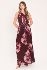 Burgundy one-shoulder pleated maxi dress with pink floral print and tied waist sash