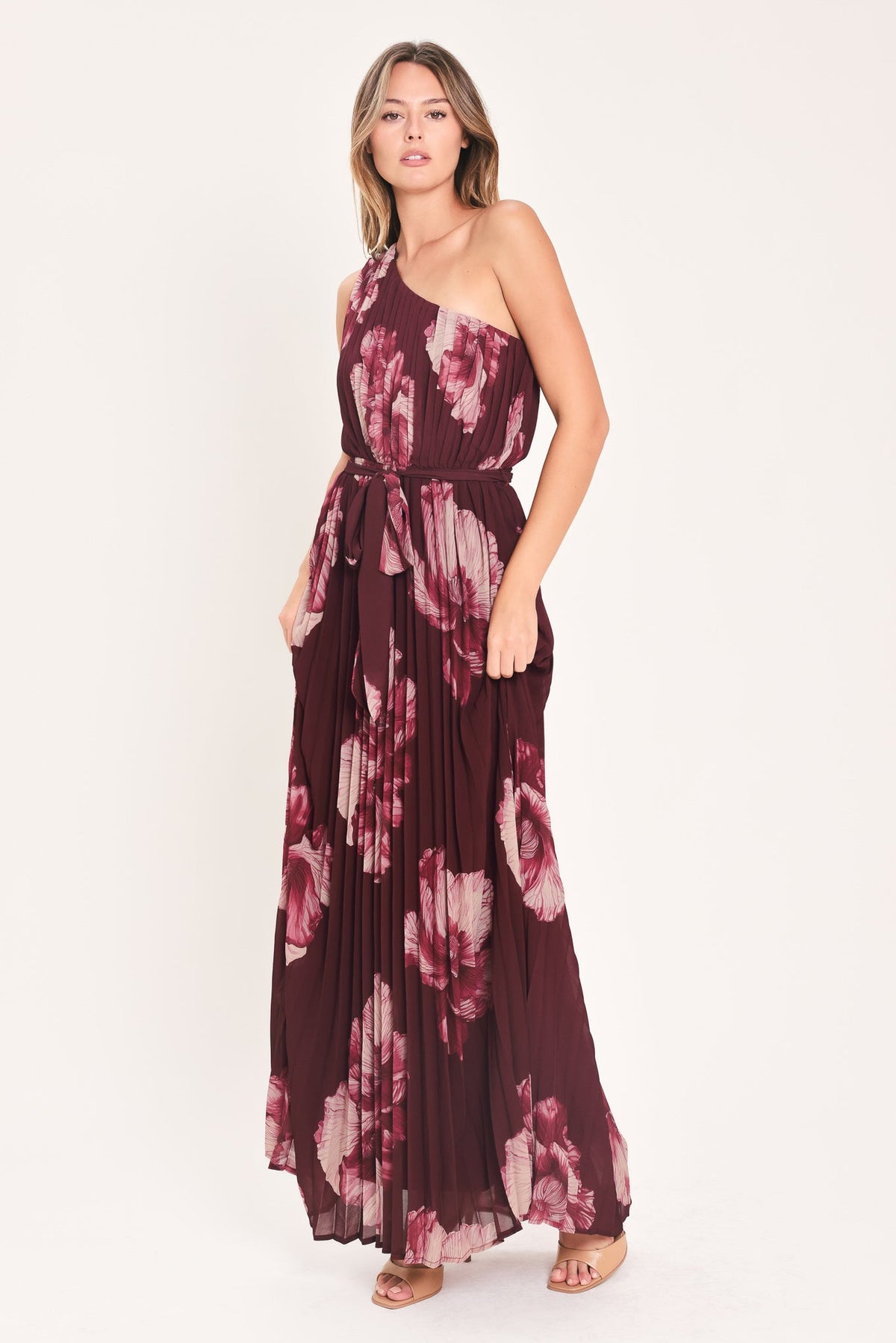 Burgundy one-shoulder maxi dress with pink floral print and flowy pleated skirt