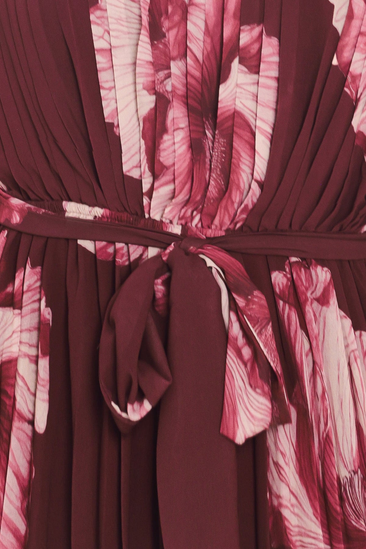 Burgundy pleated dress waist with knotted tie and pink floral fabric overlay