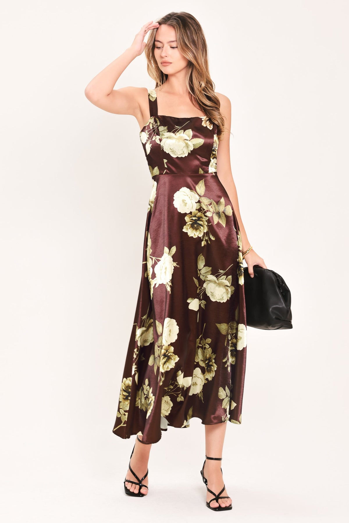 Wine woven midi dress with spaghetti straps and cream floral print, gathered waist.