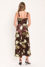 Back view of wine woven midi dress with thin straps and cream floral print.