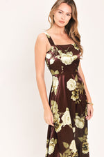 Close-up of wine floral woven midi dress with spaghetti straps and gathered waist.