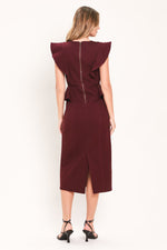Back view of burgundy midi dress with ruffle cap sleeves and center seam