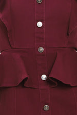 Close-up of burgundy button-front midi dress with ruffled peplum and metal buttons