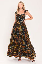 Black woven maxi dress with square neckline, ruffle shoulder straps, leaf print tiered skirt
