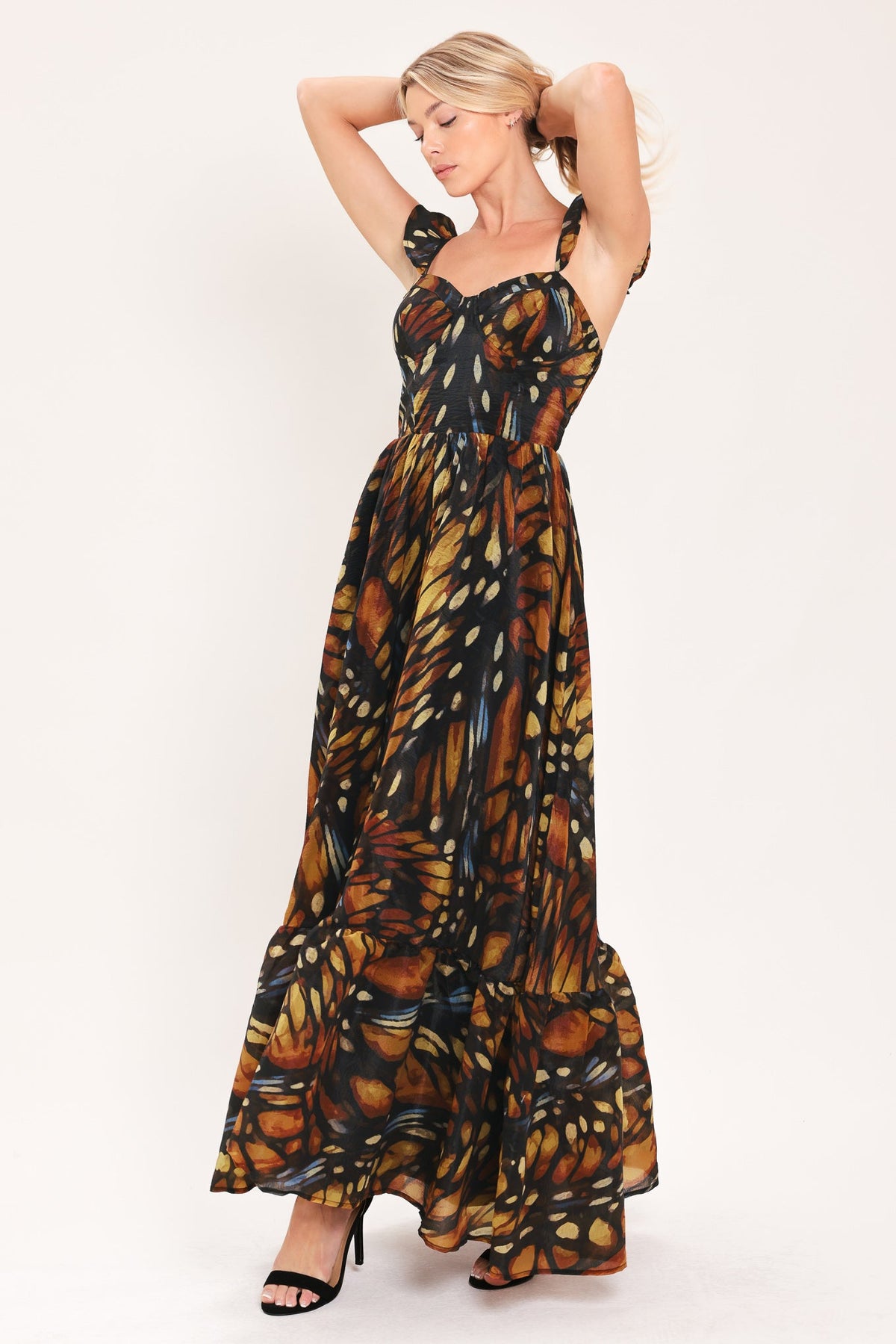Black woven maxi dress with square neckline and leaf print, tiered maxi skirt silhouette