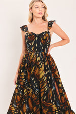 Black woven maxi dress with square neckline and ruffle straps, leaf print gathered waist