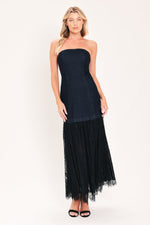 Dark indigo denim strapless tube midi dress with layered black tulle hem and heels