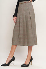 Brown plaid woven midi skirt with pleated skirt panels and belted waist