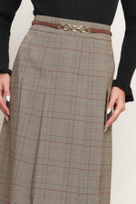 Brown plaid midi skirt with belt and decorative metal buckle at waist