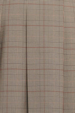 Close-up of brown plaid woven fabric with grid and windowpane lines