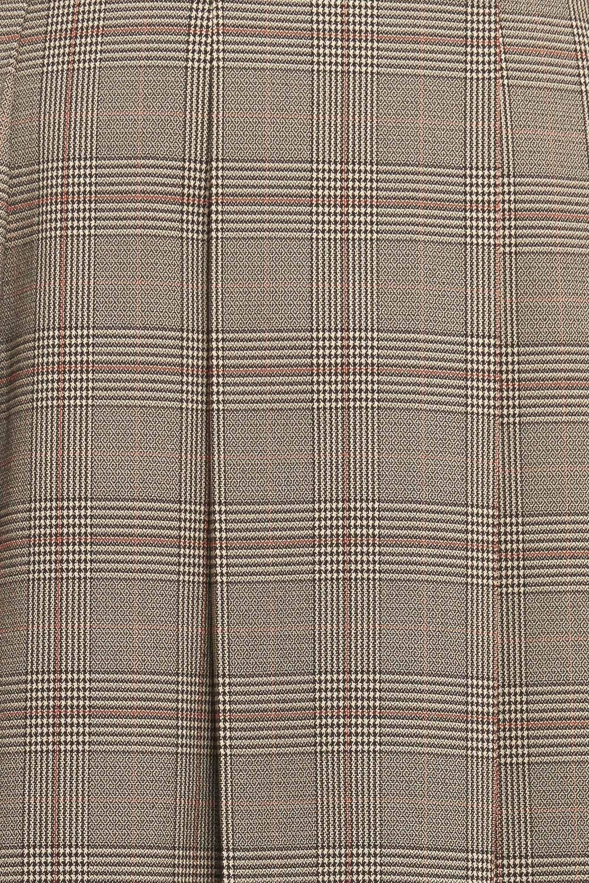 Close-up of brown plaid woven fabric with grid and windowpane lines