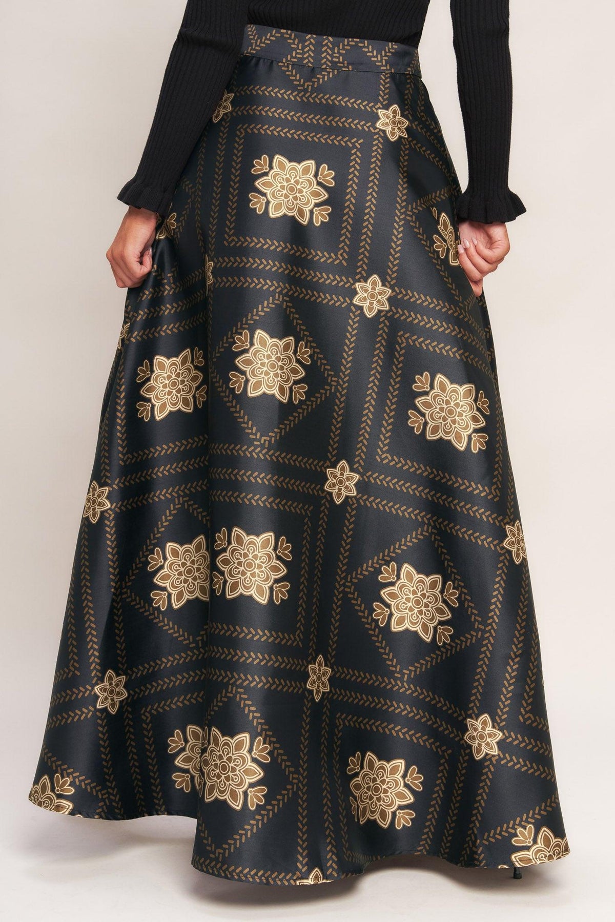 Black maxi circle skirt with gold floral lattice pattern, gathered waist