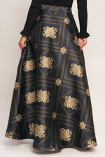 Black maxi circle skirt with gold floral lattice pattern, gathered waist