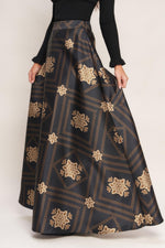 Black maxi circle skirt with gold floral lattice pattern, full flare