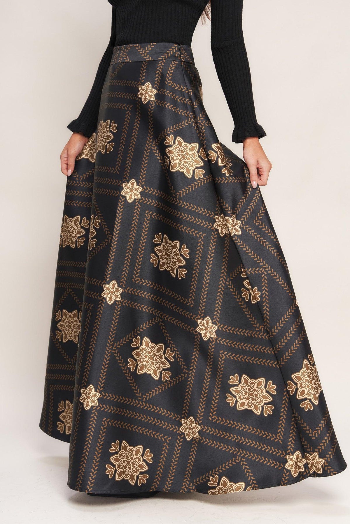 Black maxi circle skirt with gold floral lattice pattern, full flare